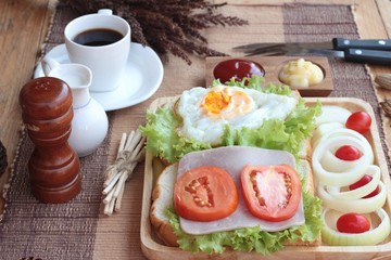 Slice bread ,ham ,fried eggs with breakfast.