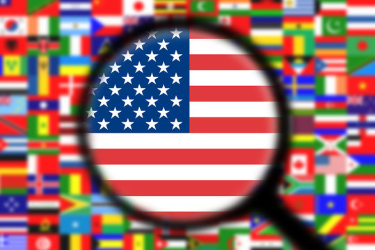 Magnifying glass on the flag of the United States of America (USA)