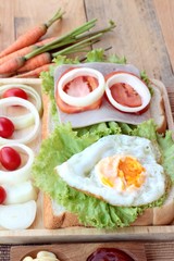 Slice bread ,ham ,fried eggs with breakfast.