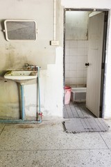 dirty washbasin and restroom