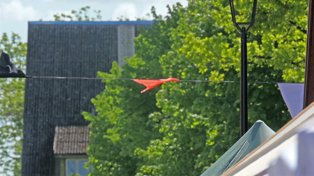 Colorful flaglets on the street hanging. It is a sign of celebration or festival in a city