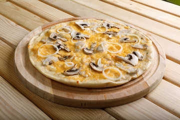 Italian pizza with  onion, bacon, mushrooms  and olives