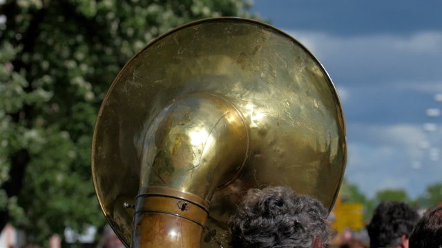 The back of a big tuba in a band. The tuba is the largest and lowest-pitched musical instrument in the brass family. 