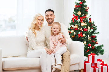 happy family at home with christmas tree