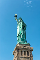 Fototapeta na wymiar Statue of Liberty Against Blue Sky in Manhattan