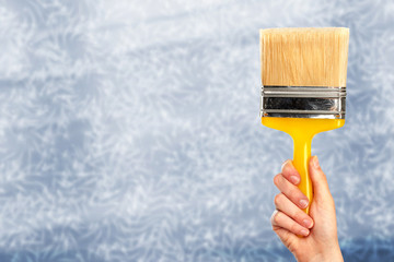 Hand of woman with a brush.