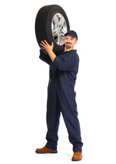 Car mechanic with a tire.