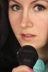 Young woman with microphone.