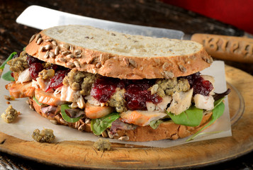 Turkey, chicken sandwich with stuffing and cranberry sauce. Christmas leftovers.