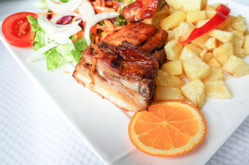 juicy grilled pork leg with fresh salad