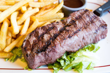 juicy steak beef meat with tomato and french fries