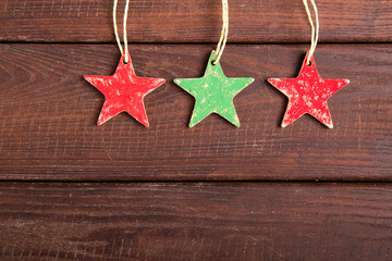 red and green stars on wooden background