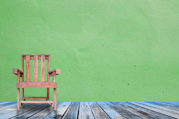  Old wooden chair in grungy interior.