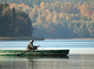 man in boat fishing