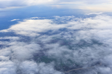 Fototapeta na wymiar Blue sky and Cloud Top view from airplane window