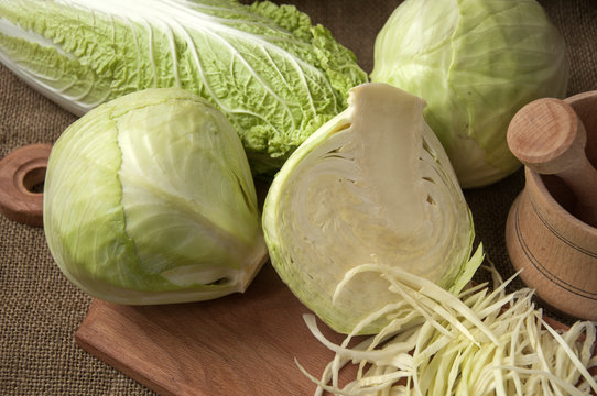 cabbage on a wooden board on a background sacking, burlap