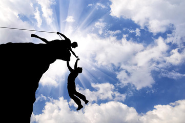 Silhouette of two climbers