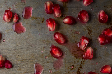 pomegranate seeds on steel plate