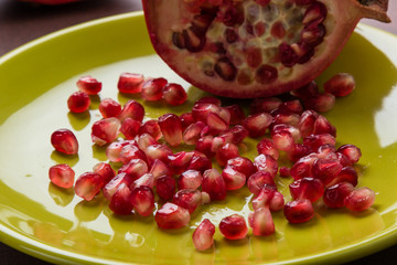 pomegranate on green plate