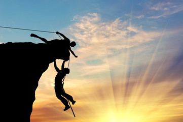 Silhouette of two climbers