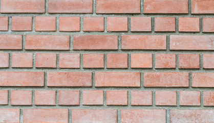 Closeup old red stone brick wall texture background