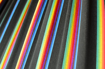 Rainbow colored stripes on black fabric 