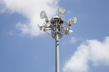 spotlight tower on blue sky and cloud..