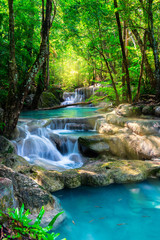 Beautiful waterfall in Thailand tropical forest - obrazy, fototapety, plakaty