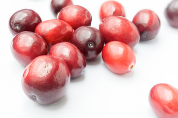Some Fresh Cranberries on white background