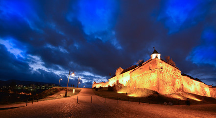 Night scene of historical citadel in Brasov city, Transylvania region, Romania