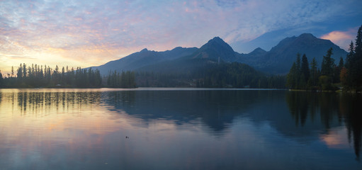 Fototapeta na wymiar sunset over a mountain lake Strbske Pleso