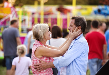 Senior couple at the fun fair