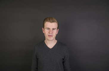 portrait of cute teenage boy with red hair