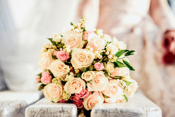 Closeup wedding bouquet with bride outdoor