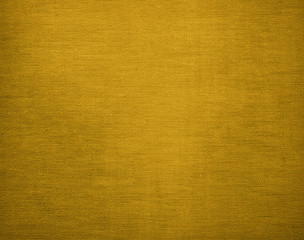 Canvas grunge background texture in elegant golden colour