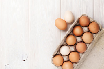 Cardboard egg box on wooden table