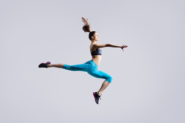 Fototapeta na wymiar Dancer girl jumping