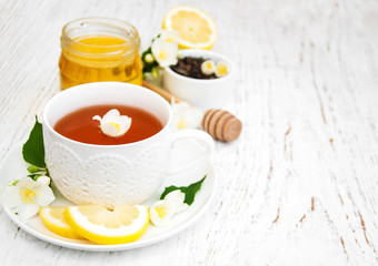 Cup of tea with jasmine flowers