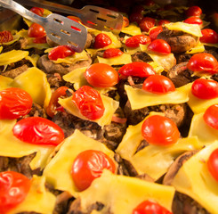 grilled stuffed mushrooms with pressed cheese and cherry tomatoes