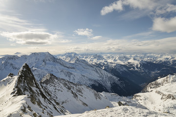 Fototapeta na wymiar rocky ridges and mountain range winter landscape