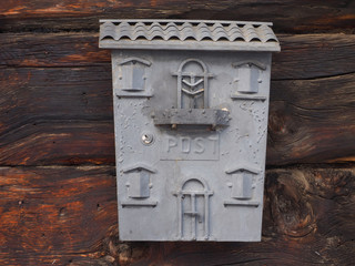Mail box on brown wood background