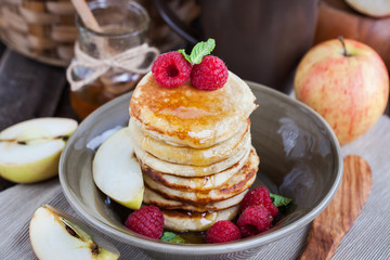Breakfast with apple pancakes with honey