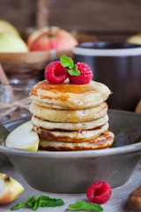 Breakfast with apple pancakes with honey