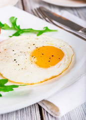 Breakfast with egg on wooden table