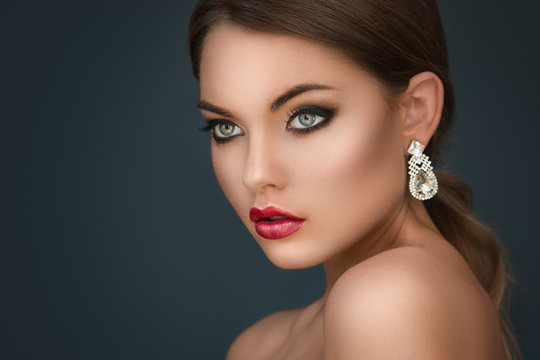 Gorgeous woman with luxury earrings