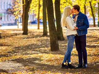 Fototapeta premium Young couple hugging and flirting in park.