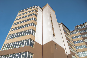 new multistory residential building in the background