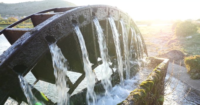 a water wheel to lift water for irrigation of grape fields