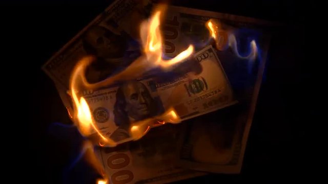 Burning 100 dollars bills
