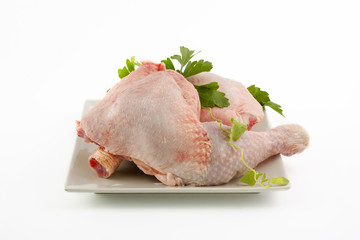 Raw chicken thighs or legs, pieces isolated background